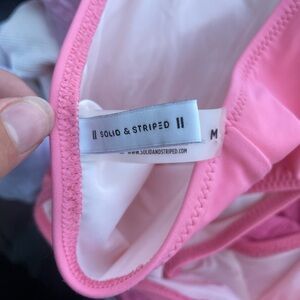 Pink one piece swim bathing suit. isometrical